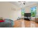 Spacious bonus room with natural light, wood floors, and comfortable seating, ideal for relaxation at 137 Leaning Tower Dr, Mooresville, NC 28117