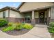 Inviting front porch with brick detailing and colorful landscaping, perfect for relaxing outdoors at 137 Leaning Tower Dr, Mooresville, NC 28117