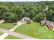 Expansive aerial view of a home with lush green lawn and mature trees at 145 Waterwood Dr, Shelby, NC 28150