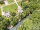 Stunning aerial view of a waterfront home with a private dock and beautifully landscaped yard at 145 Waterwood Dr, Shelby, NC 28150