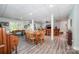 Spacious basement with laminate wood flooring, game tables, a dining table, and seating at 145 Waterwood Dr, Shelby, NC 28150