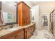 Bathroom showcasing double vanities, granite countertops, and ample storage space in wood cabinets at 145 Waterwood Dr, Shelby, NC 28150