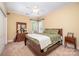 Bedroom features a large window, ceiling fan, wood furniture, and carpeted floors at 145 Waterwood Dr, Shelby, NC 28150