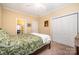 Bedroom with ceiling fan, closet, neutral carpet, and warm-toned walls at 145 Waterwood Dr, Shelby, NC 28150