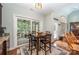 Charming breakfast nook with a sliding glass door to a screened porch at 145 Waterwood Dr, Shelby, NC 28150