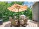Outdoor deck with dining set, umbrella, and wooded views, perfect for entertaining at 145 Waterwood Dr, Shelby, NC 28150