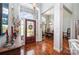 Inviting foyer featuring hardwood floors, high ceilings, and a decorative front door at 145 Waterwood Dr, Shelby, NC 28150