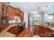 Charming kitchen with granite counters, wood floors, stainless steel appliances, and warm lighting at 145 Waterwood Dr, Shelby, NC 28150