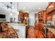 Open kitchen featuring granite countertops, stainless steel appliances, breakfast bar, and hardwood floors at 145 Waterwood Dr, Shelby, NC 28150