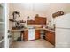 Functional kitchenette with cabinetry, appliances, and natural light, offering convenience and practicality at 145 Waterwood Dr, Shelby, NC 28150