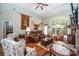 Cozy living room with a stone fireplace, large windows, and comfortable seating area at 145 Waterwood Dr, Shelby, NC 28150