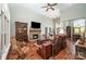 Spacious living room with hardwood floors, a stone fireplace, and ample natural light at 145 Waterwood Dr, Shelby, NC 28150