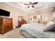 Primary bedroom featuring neutral carpeting, a ceiling fan, and ample natural light at 145 Waterwood Dr, Shelby, NC 28150