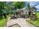 Outdoor kitchen area featuring a built-in grill, prep space, and dining area for outdoor entertaining at 145 Waterwood Dr, Shelby, NC 28150