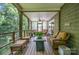 Comfortable screened porch with ceiling fan, seating, and wooded views provides a relaxing outdoor living space at 145 Waterwood Dr, Shelby, NC 28150