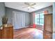 Bedroom with wood floors, and two dressers, lit by natural light through a window at 1633 Kiawah Ct, Gastonia, NC 28056