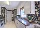 Traditional kitchen with floral wallpaper, stainless steel sink, and modern appliances at 1633 Kiawah Ct, Gastonia, NC 28056