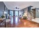 Comfortable living room with hardwood floors, a fireplace, and staircase access at 1633 Kiawah Ct, Gastonia, NC 28056