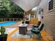 Charming backyard oasis with pool and deck featuring a modern fire pit and seating area at 1673 Beleek Ridge Ln, Clover, SC 29710