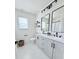 Beautiful bathroom featuring dual sinks, black hardware, and modern lighting fixtures at 1673 Beleek Ridge Ln, Clover, SC 29710