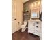 Stylish half bathroom features a wood accent wall, floating shelves, and modern vanity at 1673 Beleek Ridge Ln, Clover, SC 29710