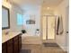 Modern bathroom featuring a soaking tub, shower, and wood vanity at 1673 Beleek Ridge Ln, Clover, SC 29710