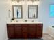 Bathroom vanity with double sinks, white countertop, framed mirrors and modern lighting at 1673 Beleek Ridge Ln, Clover, SC 29710