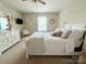 Comfortable bedroom features a well-appointed bed, serene hues, and a peaceful ambiance for a relaxing retreat at 1673 Beleek Ridge Ln, Clover, SC 29710