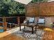 Outdoor deck featuring a seating area with a coffee table, privacy screen, and wood flooring at 1673 Beleek Ridge Ln, Clover, SC 29710
