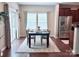 Cozy dining area with natural light, a wooden table, and a view of the backyard at 1673 Beleek Ridge Ln, Clover, SC 29710