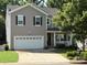 Charming two-story home with a two-car garage and well-maintained lawn at 1673 Beleek Ridge Ln, Clover, SC 29710