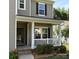 Close up of a welcoming front porch with white railing and manicured landscaping at 1673 Beleek Ridge Ln, Clover, SC 29710