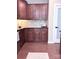 Kitchen featuring dark wood cabinets, stainless steel appliances, and granite countertops at 1673 Beleek Ridge Ln, Clover, SC 29710