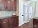 Stylish kitchen details including granite countertops and dark wood cabinets at 1673 Beleek Ridge Ln, Clover, SC 29710