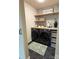 Well-organized laundry room boasts modern appliances, ample storage, and stylish finishes for a convenient and functional space at 1673 Beleek Ridge Ln, Clover, SC 29710