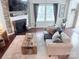 Cozy living room features a fireplace, ceiling fan, and comfortable seating arrangement at 1673 Beleek Ridge Ln, Clover, SC 29710