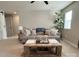 Bright and inviting living room with a comfortable sofa, a wooden coffee table, and a charming barn door at 1673 Beleek Ridge Ln, Clover, SC 29710