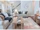 Comfortable living room with neutral tones, a cozy rug, and ample natural light at 1673 Beleek Ridge Ln, Clover, SC 29710