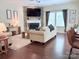 Cozy living room features a stone fireplace and hardwood floors at 1673 Beleek Ridge Ln, Clover, SC 29710