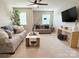 Spacious living room with neutral decor and comfortable seating provides an inviting space for relaxation and entertainment at 1673 Beleek Ridge Ln, Clover, SC 29710