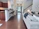 Open concept living room and kitchen featuring hardwood floors and plenty of natural light at 1673 Beleek Ridge Ln, Clover, SC 29710