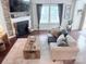 Comfortable living room features a stone fireplace and ample natural light at 1673 Beleek Ridge Ln, Clover, SC 29710