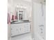Bright bathroom featuring a shower/tub and white vanity with black countertop at 1713 Andover Nw St, Concord, NC 28027