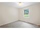 Bedroom with neutral paint, ceiling fan, and carpeted floors at 1713 Andover Nw St, Concord, NC 28027