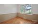 Cozy bedroom with hardwood floors, neutral paint, and a window that allows ample natural light at 1713 Andover Nw St, Concord, NC 28027