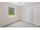 Bedroom featuring neutral paint, carpeted floors, and a window at 1713 Andover Nw St, Concord, NC 28027