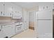The kitchen features white appliances, including a refrigerator, oven, and dishwasher at 1713 Andover Nw St, Concord, NC 28027