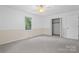 Large, bright bedroom featuring a closet and window with natural light at 1713 Andover Nw St, Concord, NC 28027