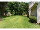 Spacious backyard with lush lawn, mature trees, privacy landscaping and storage shed at 2019 Steeplechase Dr, Rock Hill, SC 29732