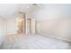 Spacious carpeted bedroom with white trim, ceiling fan and walk-in closet at 2019 Steeplechase Dr, Rock Hill, SC 29732